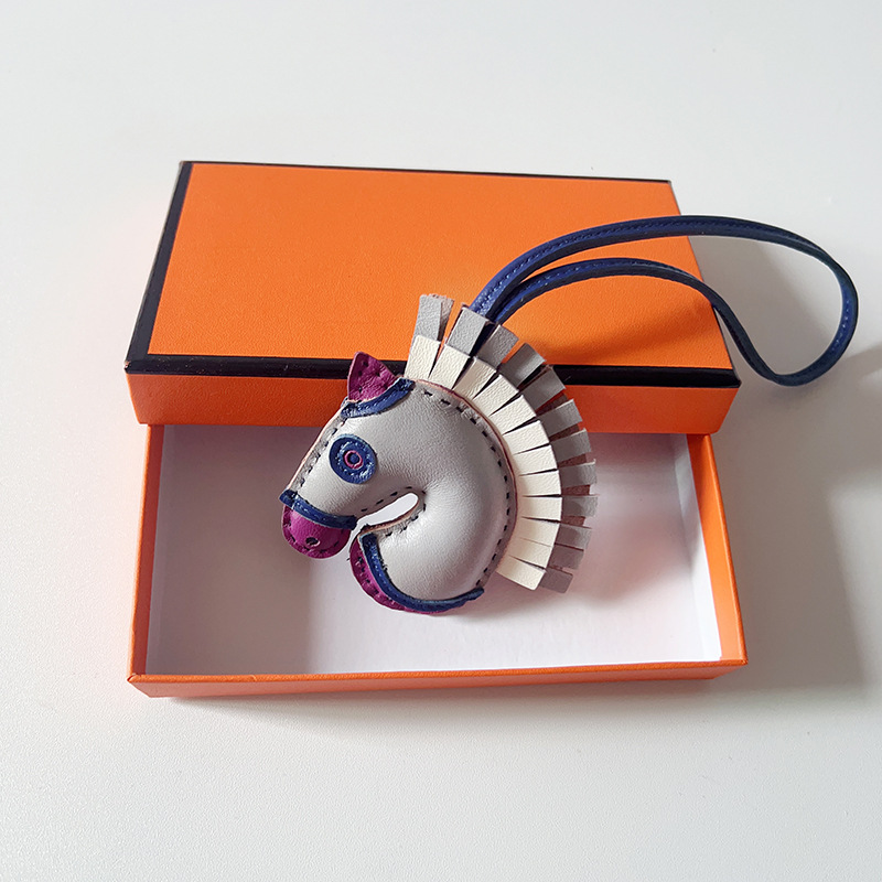 Handsewn unicorn pendant - MOVEMENTARTISAN