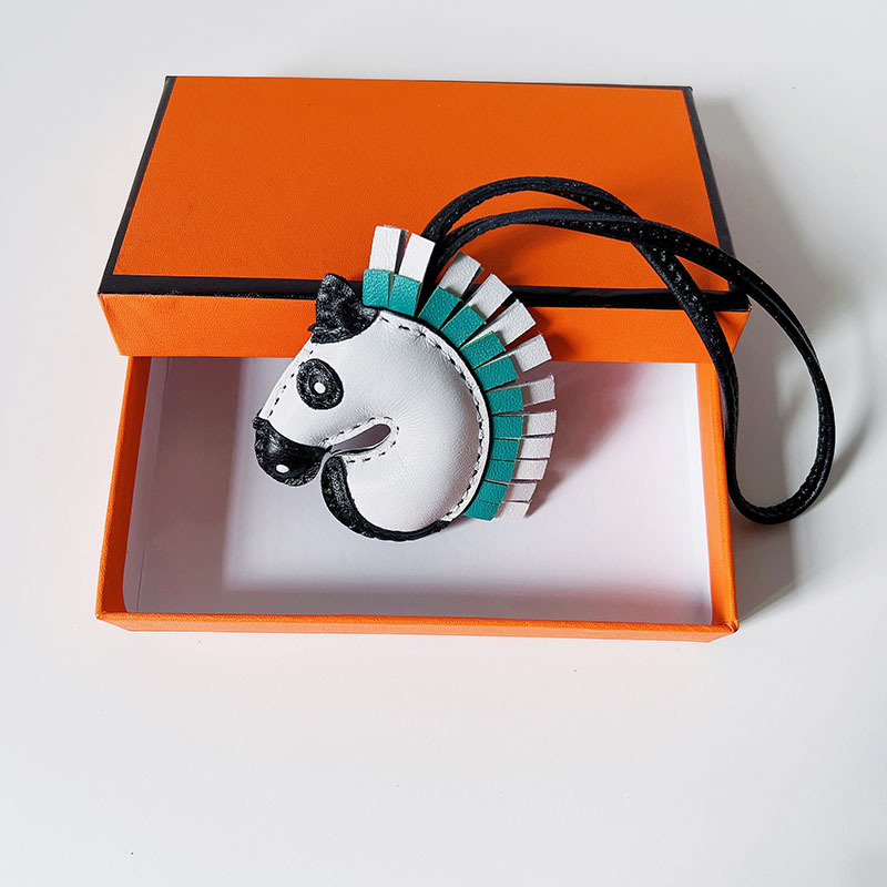 Handsewn unicorn pendant - MOVEMENTARTISAN