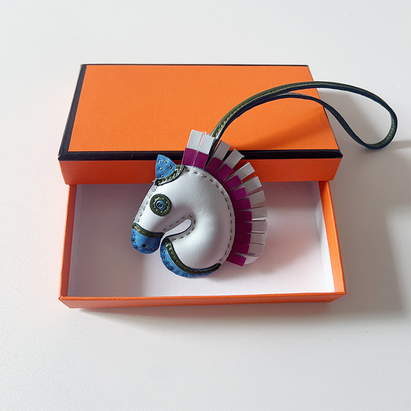 Handsewn unicorn pendant - MOVEMENTARTISAN